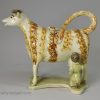 Pearlware pottery cow creamer decorated with underglaze enamels, circa 1820