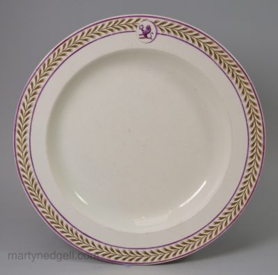 Wedgwood creamware pottery plate with a crest, circa 1820