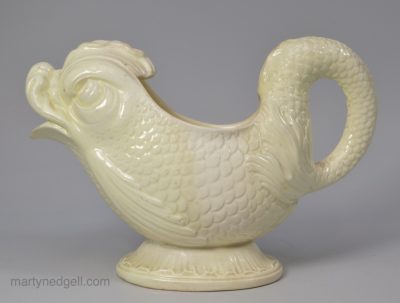 Creamware pottery dolphin sauce boat, circa 1780