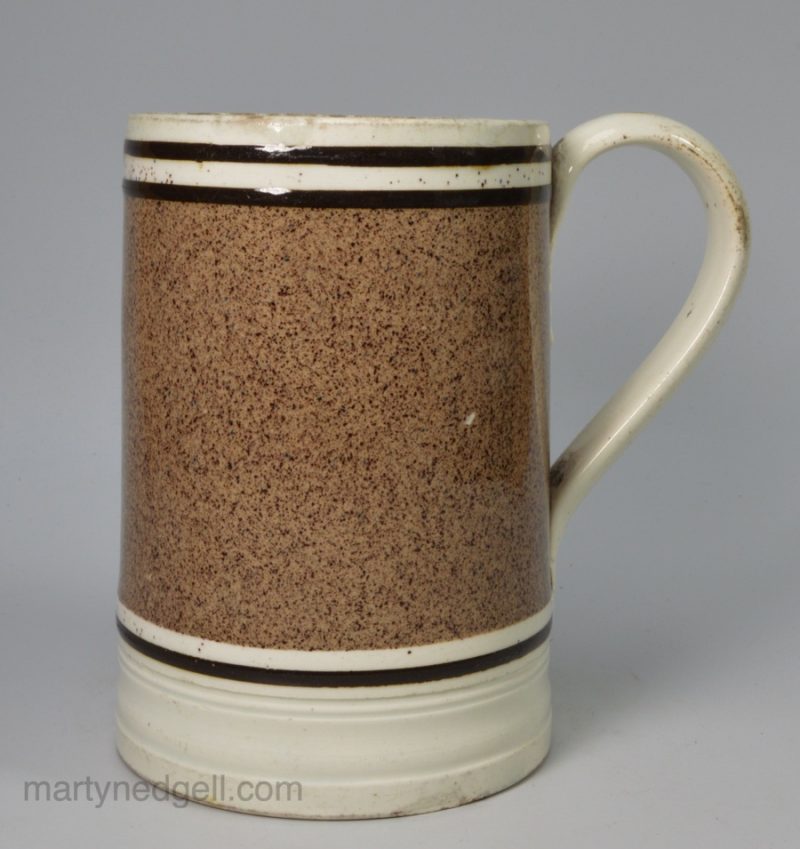 Pearlware pottery mug with powdered slip decoration, circa 1820
