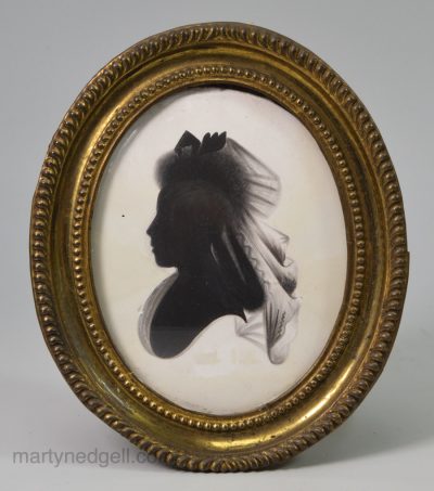 Silhouette painted on plaster in it's original pressed brass frame, circa 1790, possibly Miers