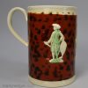 Creamware pottery mug decorated with named sprigs of Lord Rodney and brown mottled slip, circa 1795