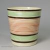 Creamware pottery beaker decorated with slip bands, circa 1820