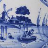 Liverpool delft tile decorated in blue with fishermen using nets, circa 1750