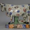 Yorkshire type prattware pottery cow and attendant, circa 1820