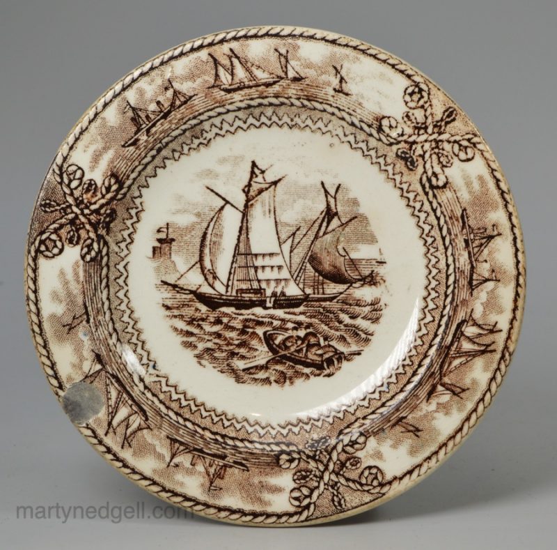 Pearlware pottery cup plate decorated with American Marine transfer in brown under the glaze, circa 1836