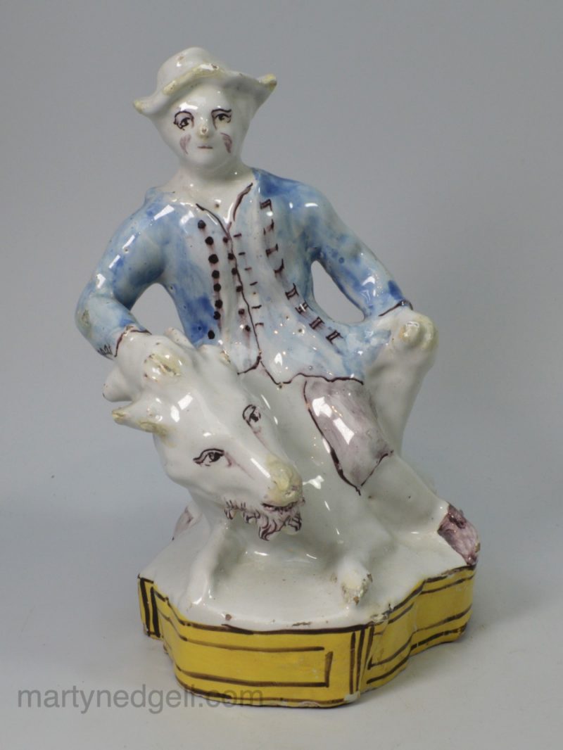 German tin glaze figure of a man riding a goat, circa 1750