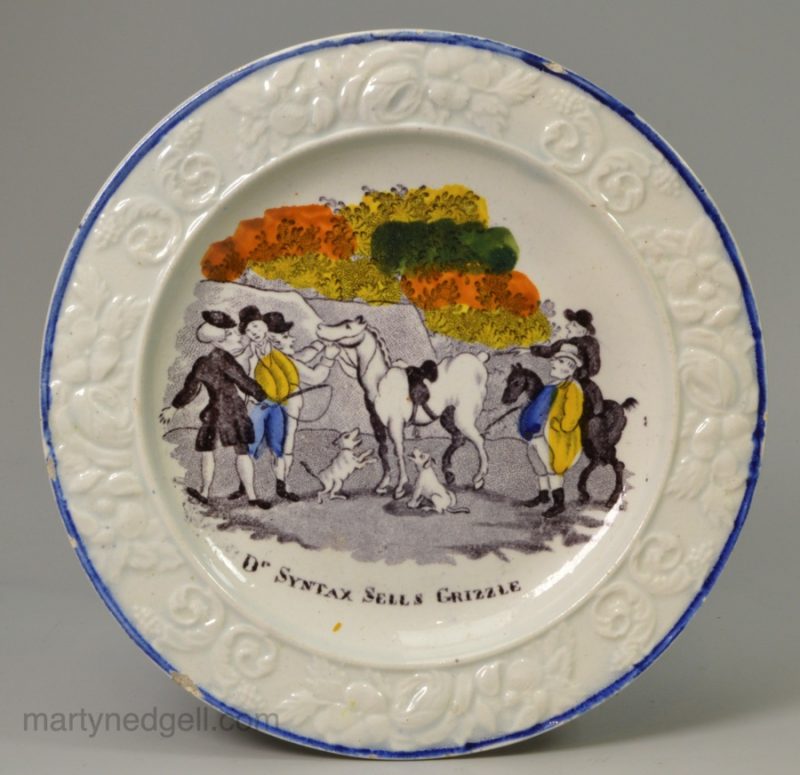 Prattware pottery child's plate "Dr. Syntax Sells Grizzle", circa 1820