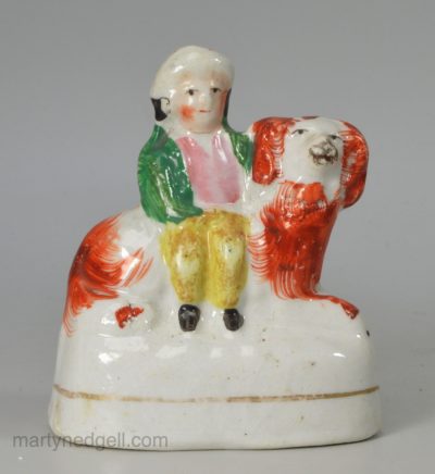 Small Staffordshire boy on a spaniel, circa 1870