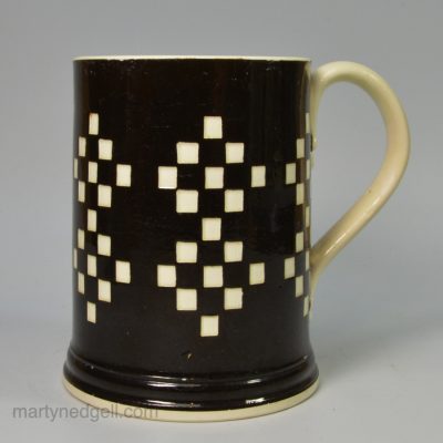 Creamware pottery mug with mocha type slip decoration, circa 1820