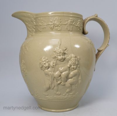 Large Spode drabware jug moulded with bacchanalian boys, circa 1820