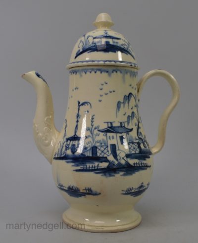 Small creamware pottery coffee pot decorated in underglaze blue, circa 1790