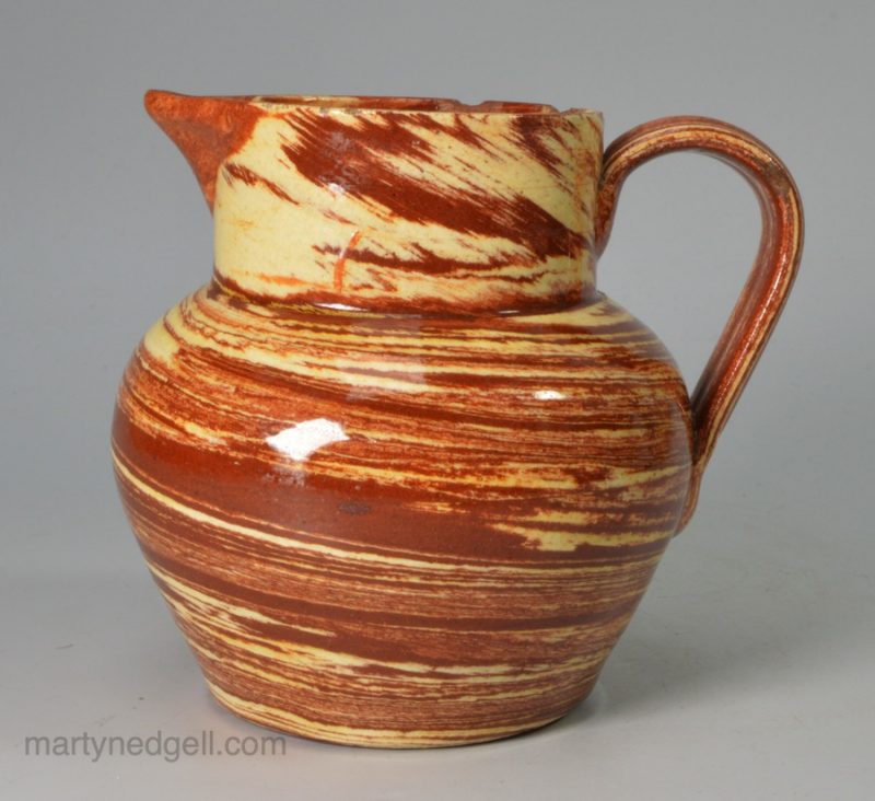 Small solid agateware jug, circa 1840