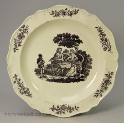 Small creamware pottery plate printed with the tea party pattern, circa 1780