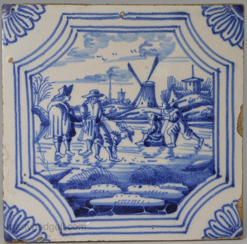 Dutch Delft tile painted with canal ice skaters, circa 1750