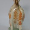 Pearlware pottery cow creamer decorated with enamels under the glaze, circa 1820