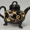 Staffordshire Jackfield black teapot decorated with cream coloured sprigs, circa 1770