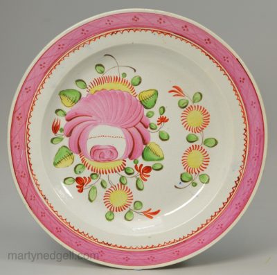 Pearlware pottery plate decorated with over glaze enamels, circa 1820