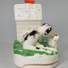 Staffordshire porcelain figure of a hound and her pup, circa 1860