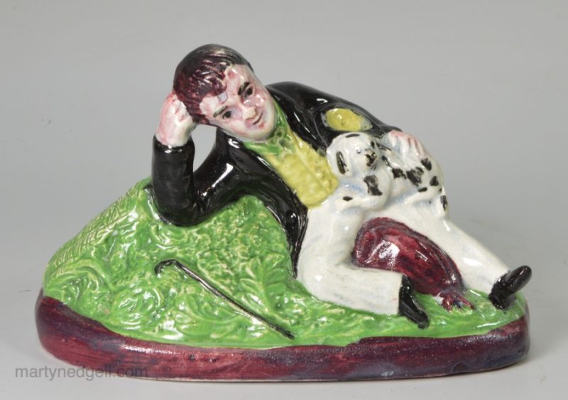 Pearlware pottery boy with his dog, circa 1820 Scottish Pottery