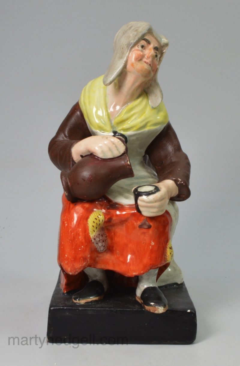 Staffordshire pearlware pottery figure of the cobbler's wife, circa 1820