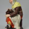 Staffordshire pearlware pottery figure of the cobbler's wife, circa 1820