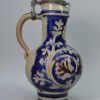Tall Westerwald saltglaze stoneware jug decorated with a coat of arms, circa 1700