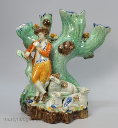 Large prattware pottery figural spill vase decorated with colours under a pearlware glaze, circa 1800