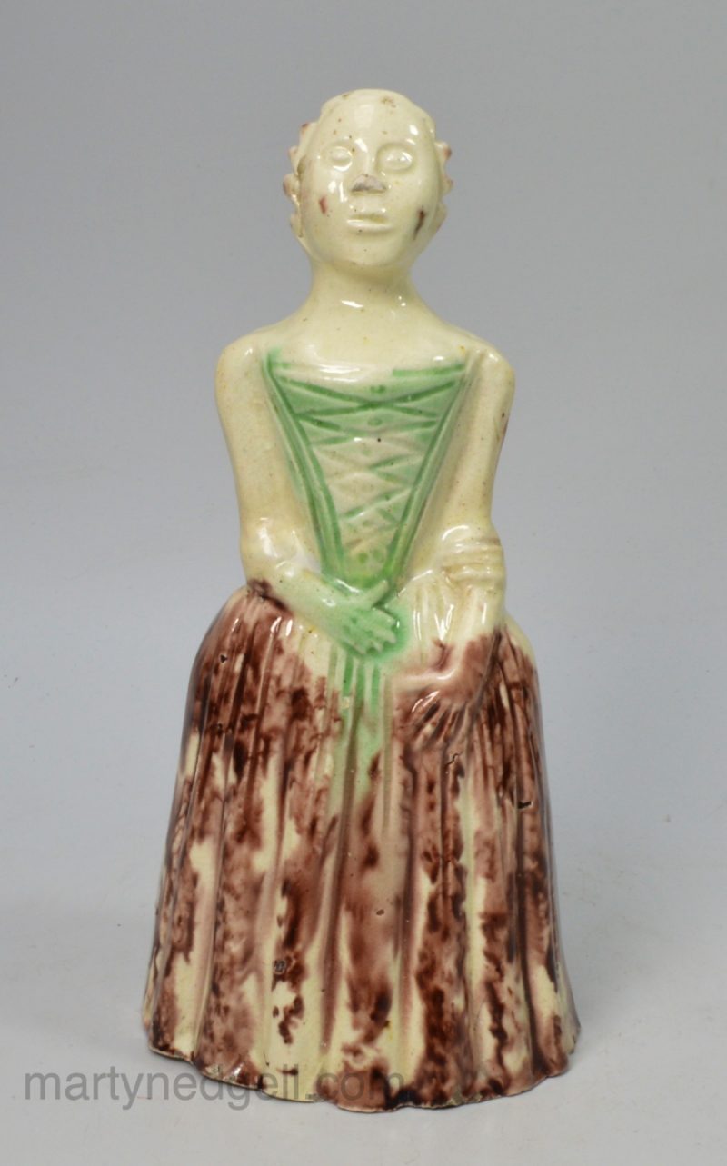 Creamware pottery figure decorated with coloured oxides under the glaze, circa 1750