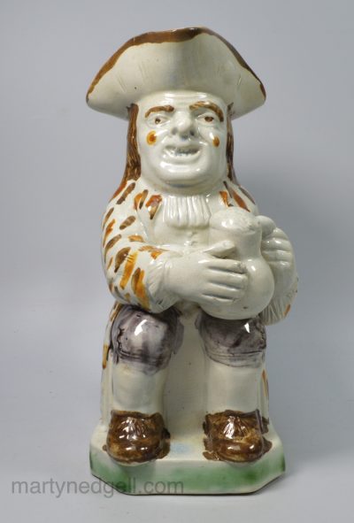 Prattware pottery Toby jug decorated with high fired colours under the pearlware glaze, circa 1810