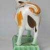 Prattware pottery cow creamer decorated with colours under a pearlware glaze, circa 1820
