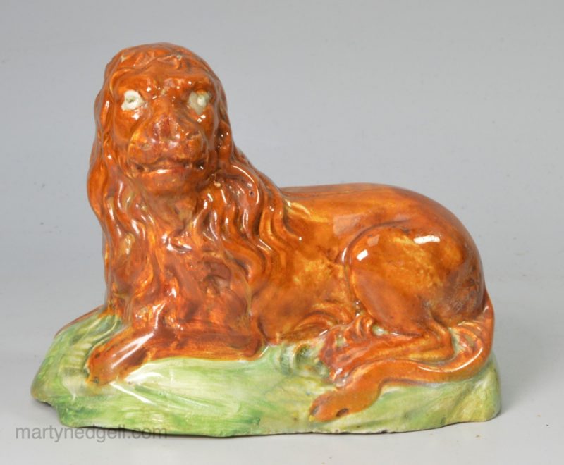 Pearlware pottery lion decorated with colours under the glaze, circa 1800