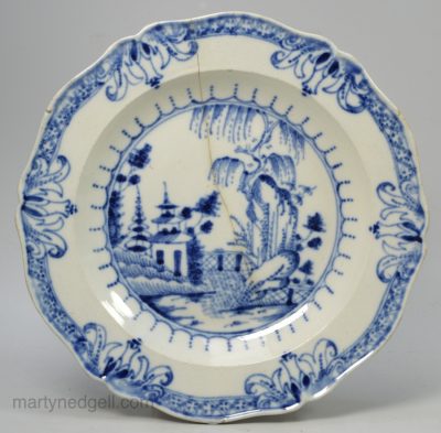 Pearlware pottery plate painted in blue under the glaze, circa 1800