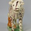 Pearlware pottery cow creamer decorated with enamels under the glaze, circa 1810