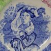 Small pearlware pottery plate commemorating Queen Victoria and decorated with a sponged border, circa 1840