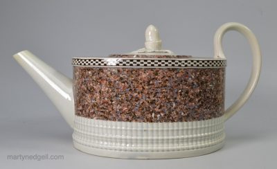 Pearlware pottery teapot decorated with surface agate, circa 1800