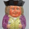 Staffordshire pearlware pottery Toby jug decorated with enamels over the glaze, circa 1820