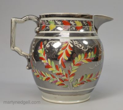 Pearlware pottery jug decorated with silver resist lustre and overglaze enamels, circa 1820