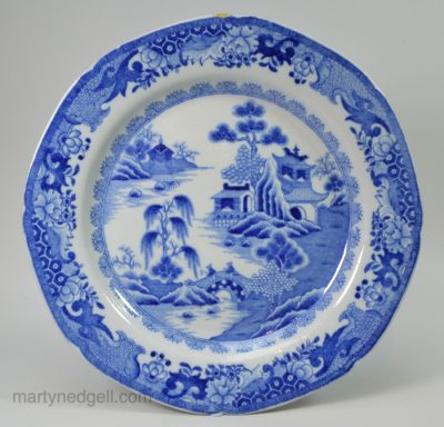 Ironstone pottery plate decorated with a blue Chinoiserie transfer print, circa 1820