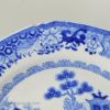 Ironstone pottery plate decorated with a blue Chinoiserie transfer print, circa 1820