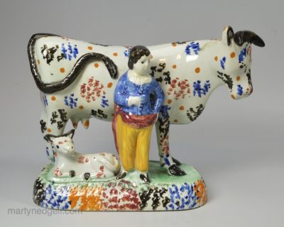 Yorkshire type prattware pottery cow group, circa 1820