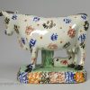 Yorkshire type prattware pottery cow group, circa 1820