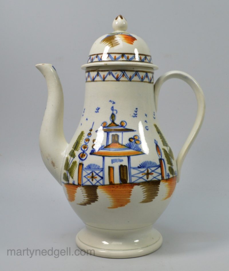 Pearlware pottery coffee pot decorated with high fired enamels under the glaze, Prattware, circa 1810