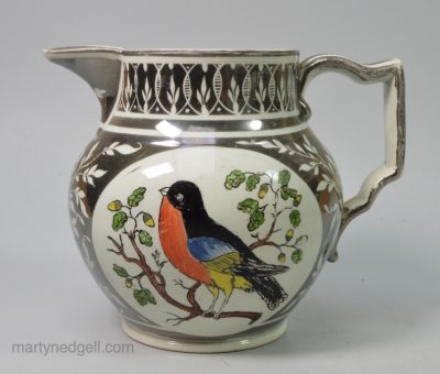 Pearlware pottery jug decorated with silver resist lustre and coloured prints of birds, circa 1820