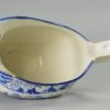 Pearlware pottery sauce boat decorated with a blue transfer print of a Stately Home. under the glaze, circa 1820