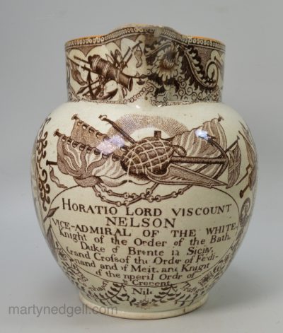 Commemorative pearlware pottery jug decorated with prints relating to the death of Nelson and his naval victories, circa 1805