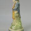Prattware pottery figure devoted with enamels under a pearlware glaze, circa 1790