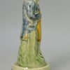 Prattware pottery figure devoted with enamels under a pearlware glaze, circa 1790