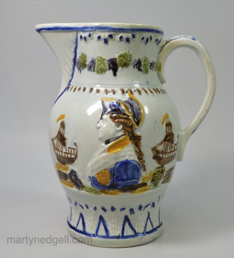 Commemorative prattware pottery jug moulded with the profiles of Admiral Duncan and Captain Trollope, circa 1800