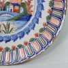 London delft polychrome charger with ribbed moulded rim, circa 1720